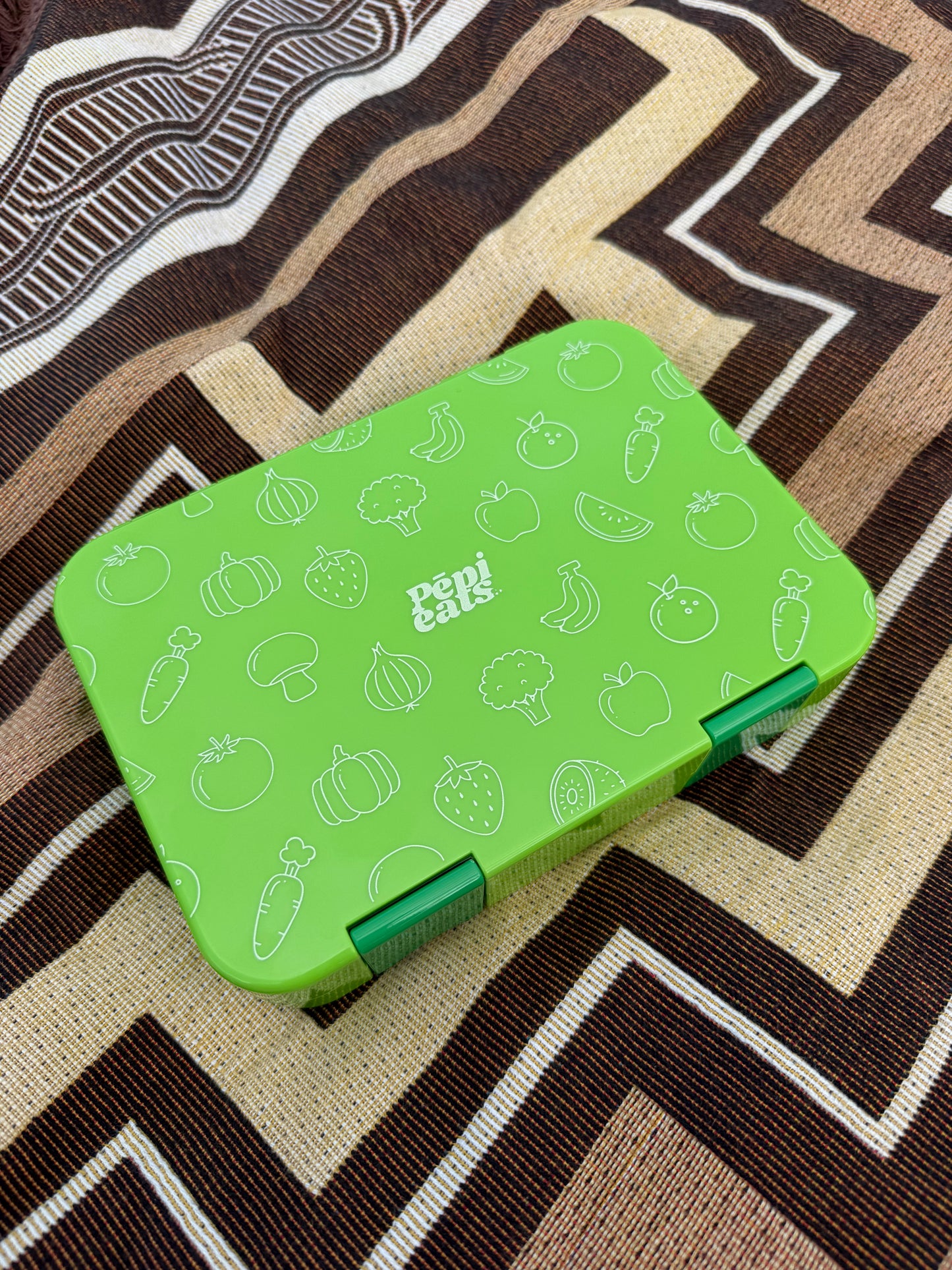 Green divided bento box for tamariki school lunches